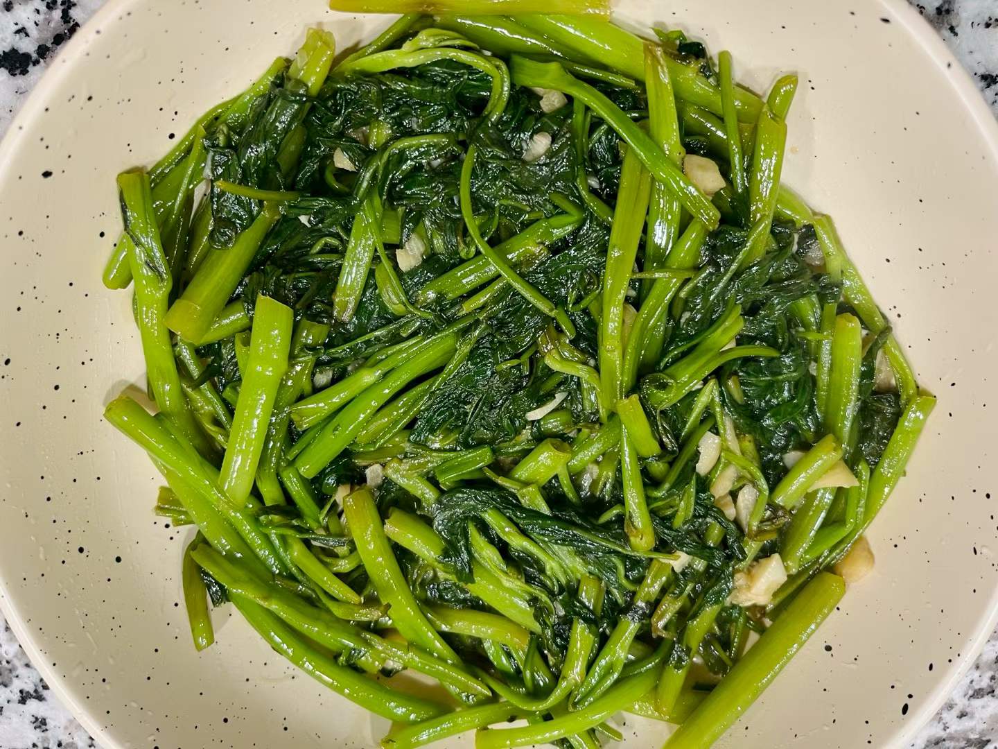 Homemade garlic stir-fried water spinach